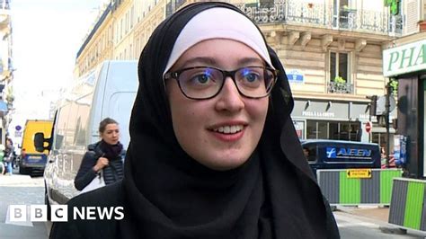 france sues student over headscarf